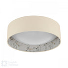 An English Heritage ceiling light with a bird and blossom pattern, viewed from below, off.