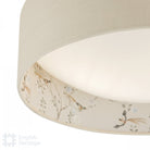 Close-up of the bird and blossom pattern on an English Heritage ceiling light.