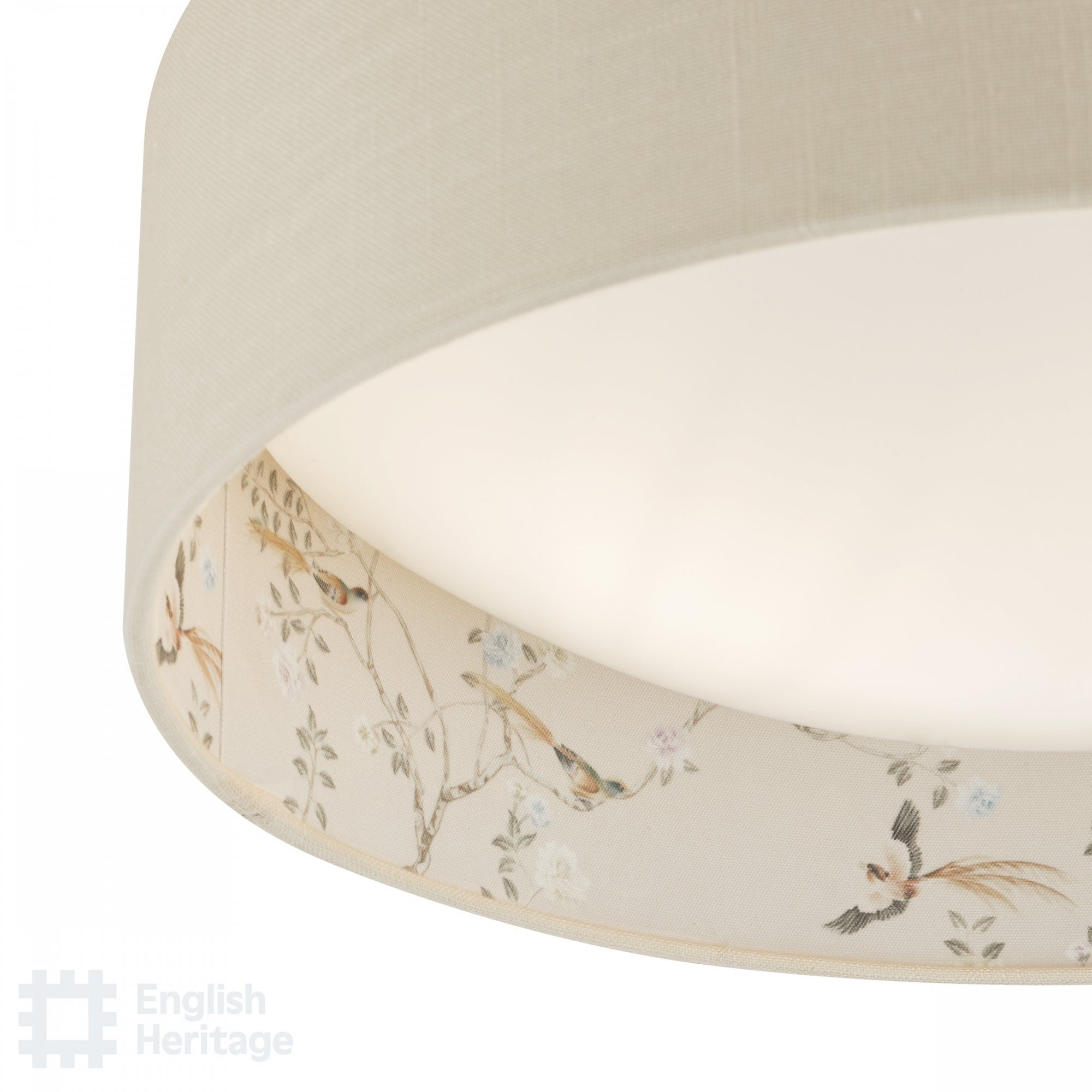 Close-up of the bird and blossom pattern on an English Heritage ceiling light.