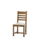 Front 3/4 view of a single oak ladder-back dining chair with a cream seat.