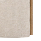 A close-up of the upholstered cushion on the wooden storage bench.