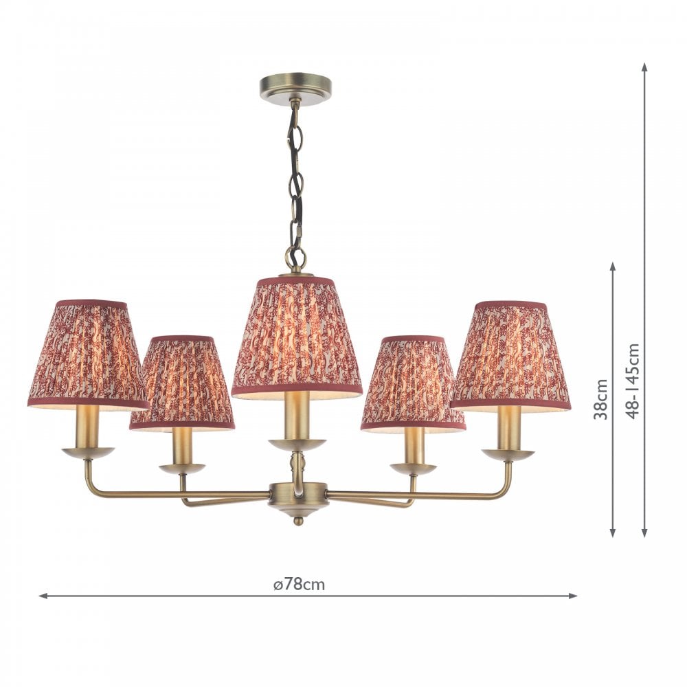 A brass five-arm chandelier with red patterned fabric shades, including dimensions.