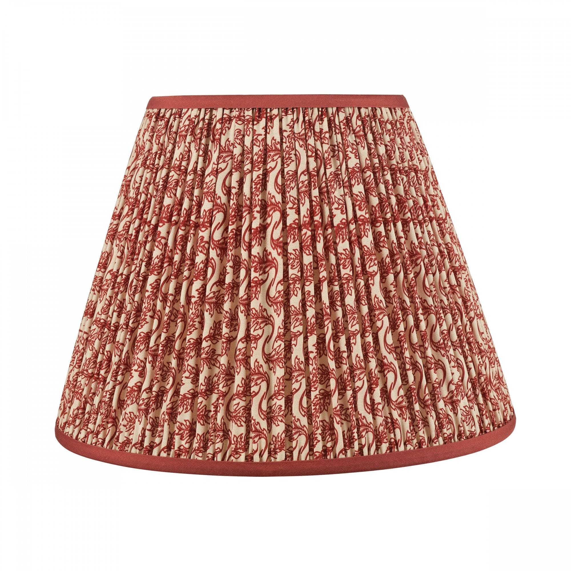 A pleated red and white patterned lamp shade with a solid red trim.