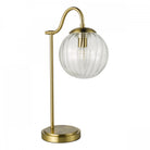 Table lamp featuring a brass stem and a clear, ribbed glass sphere on a white background.