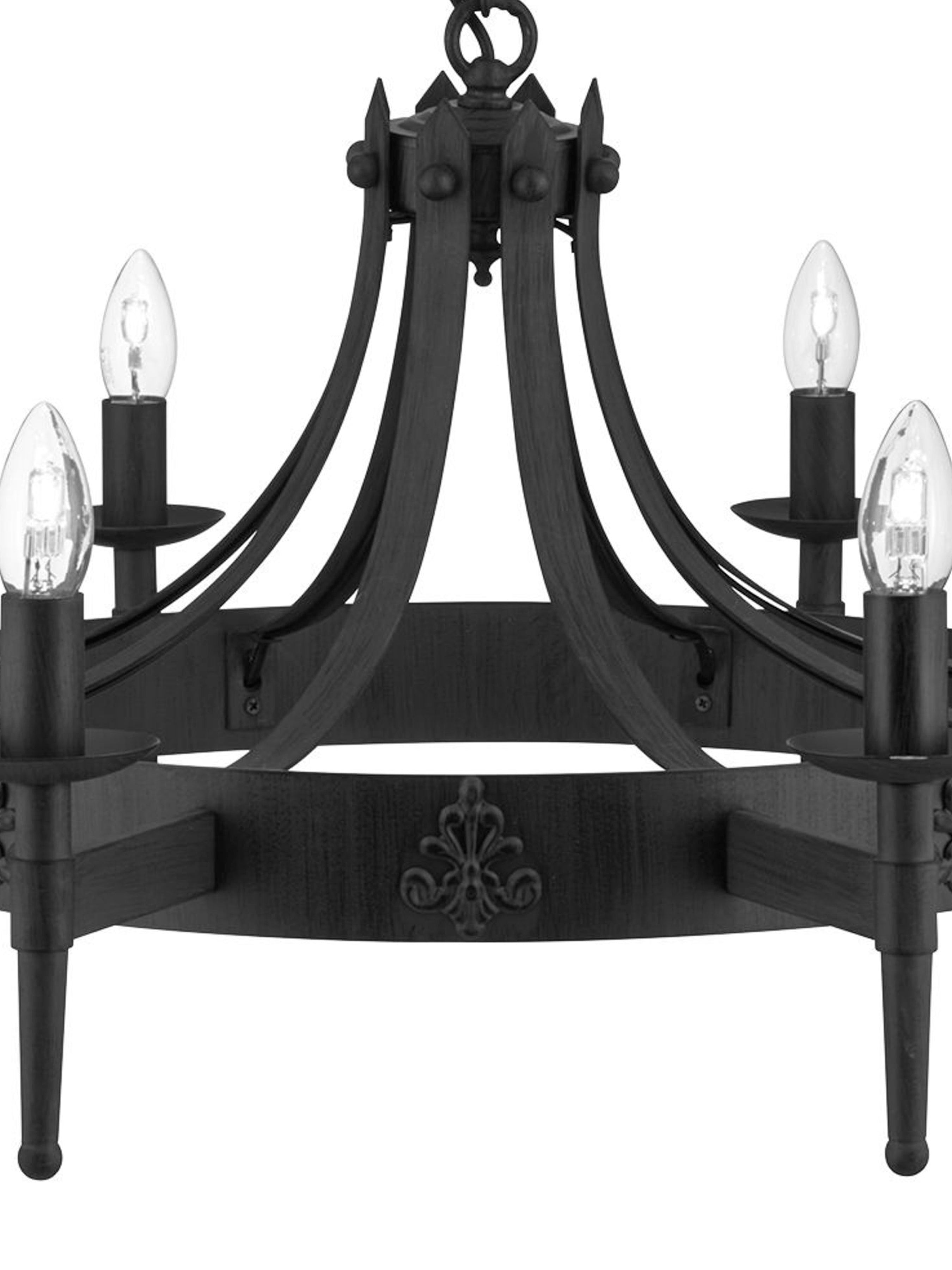 A close-up of the base of a black, round chandelier with five candle-style lights visible.
