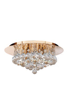 A luxurious gold and crystal flush mount ceiling light with faceted crystal balls.