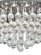 A close-up of the faceted crystal beads on the luxurious ceiling light fixture.