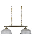 A brass light fixture with two textured white shades and chains on a white background.