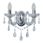 A two-bulb wall sconce with crystal accents and clear bulbs.