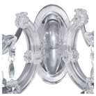 A close-up view of the chrome base and crystal arms of the sconce.