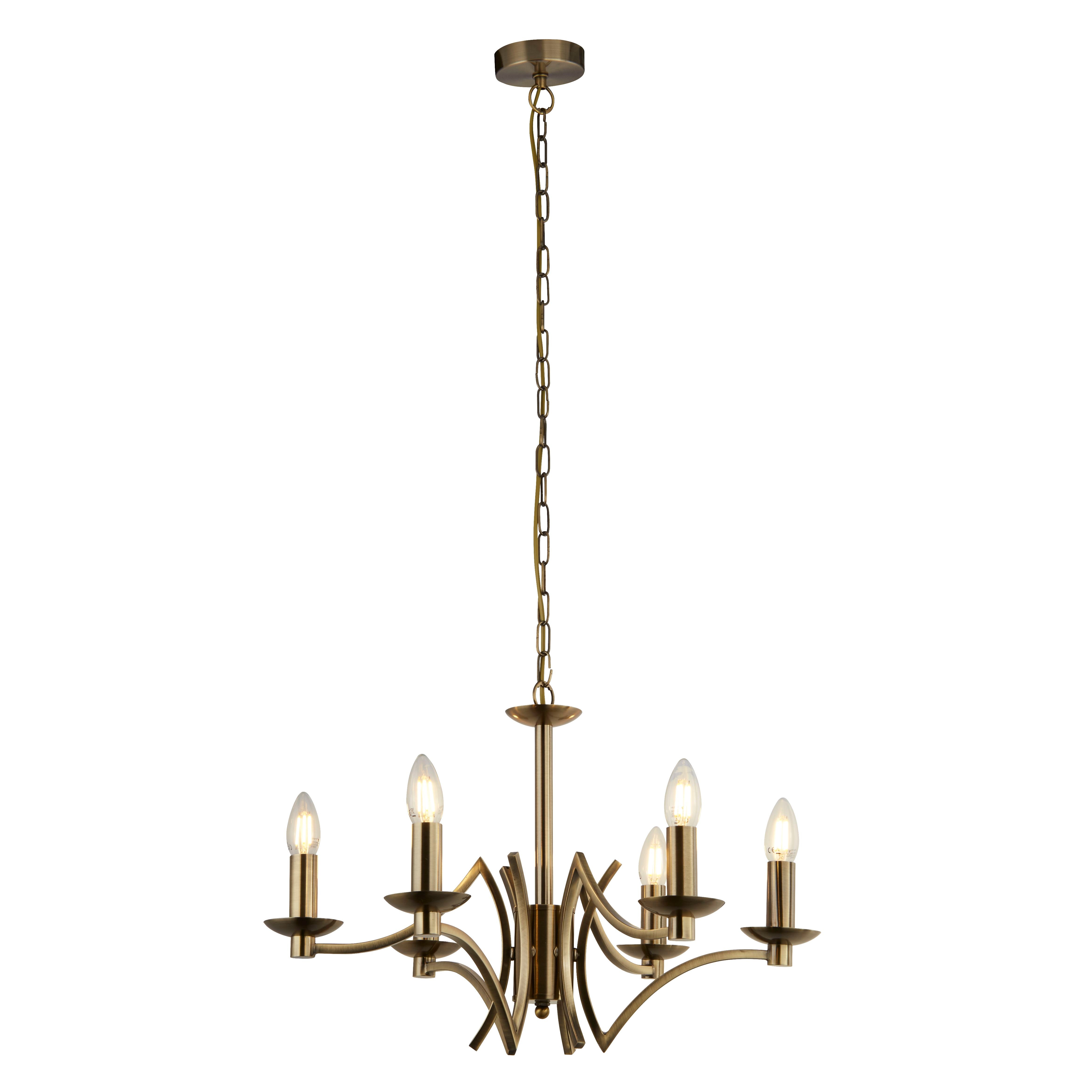 A brass chandelier with five lights hanging from a chain.