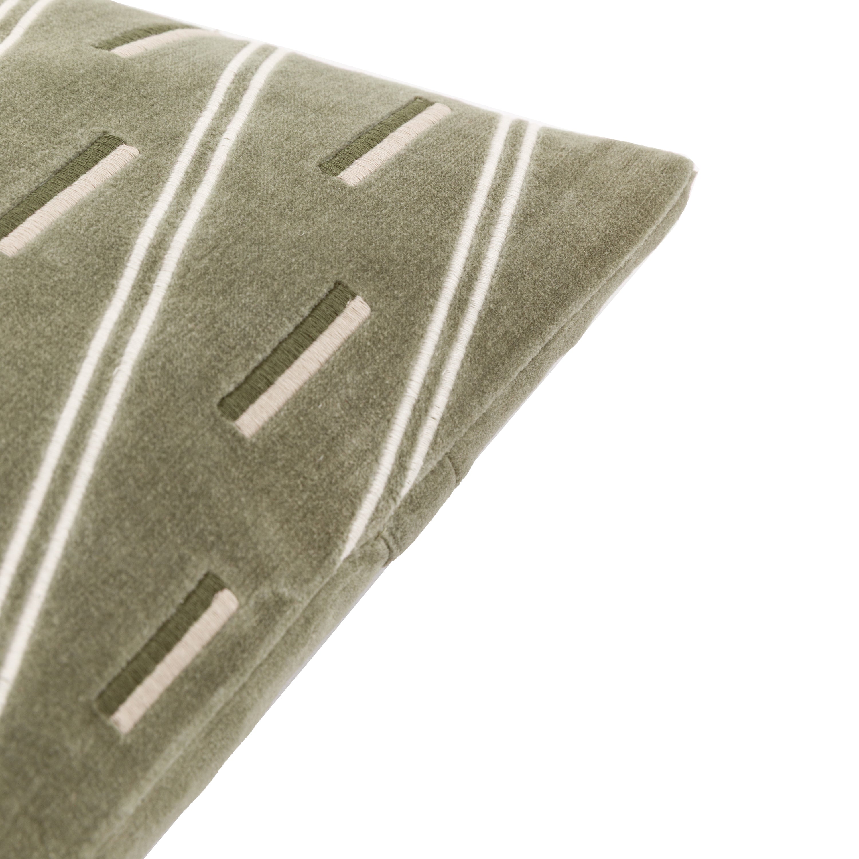 Close-up of the textured olive green pillow.