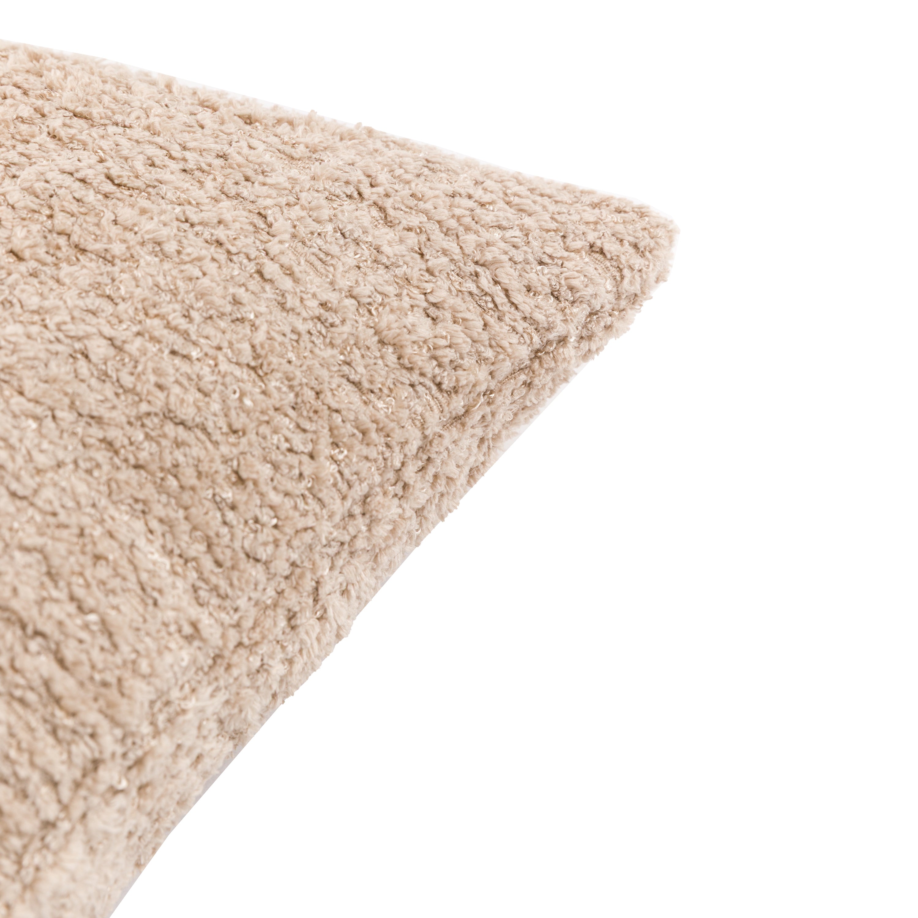 A corner view of a beige bouclé throw pillow, emphasizing the tactile texture of the fabric.