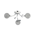 Chrome ceiling light with three crystal orb shades and decorative leaves.