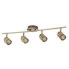 Four antique brass finish track lights with unlit bulbs on a white background.