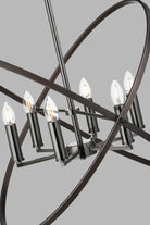Close-up of a modern chandelier's six exposed bulbs and dark metal rings.