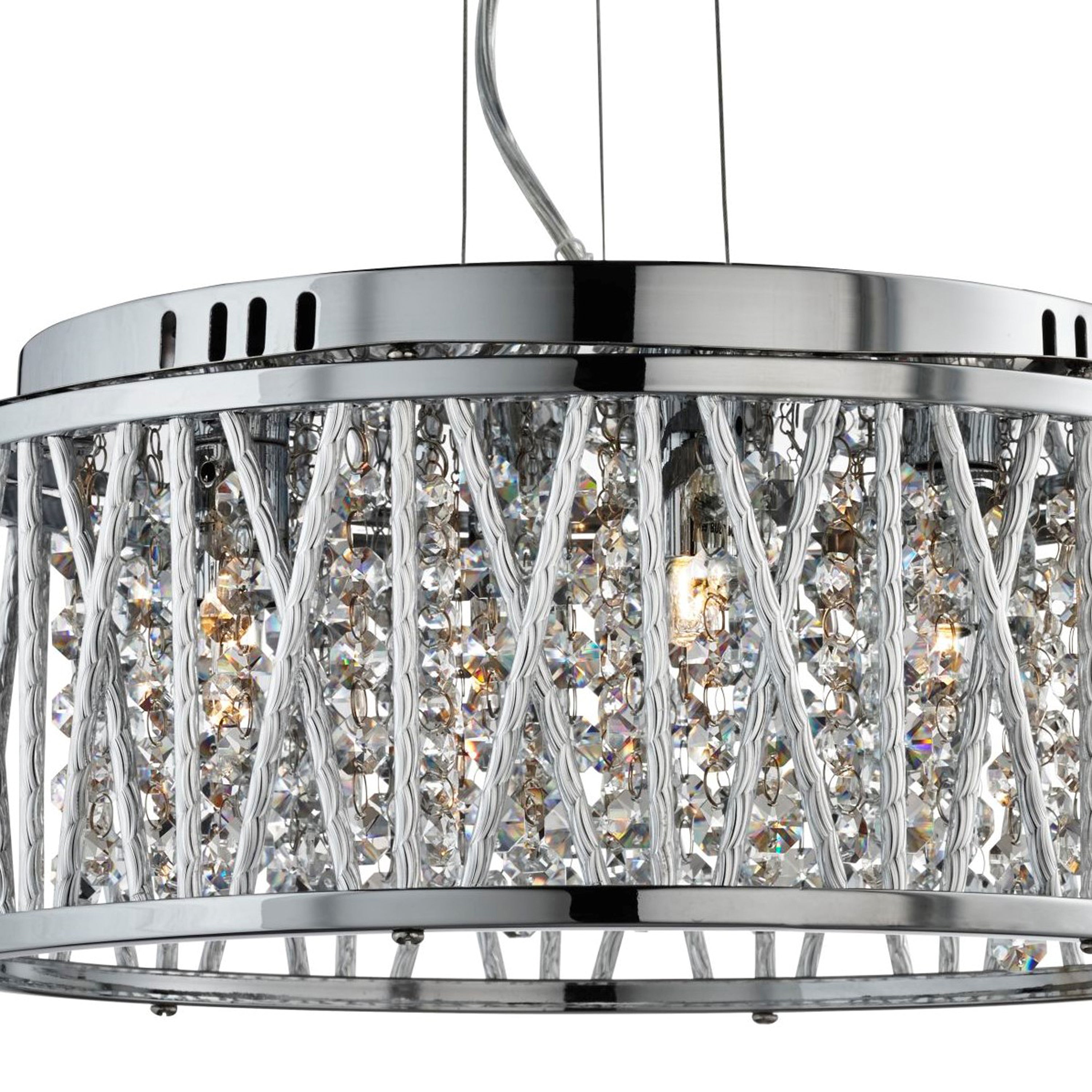 Close-up of a chrome pendant light with crystal filling and linear cage design, illuminated.