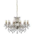 A 12-light crystal chandelier with a brass finish on a white background.