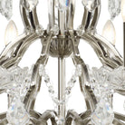 Close-up of the brushed chrome and crystal details of a chandelier.