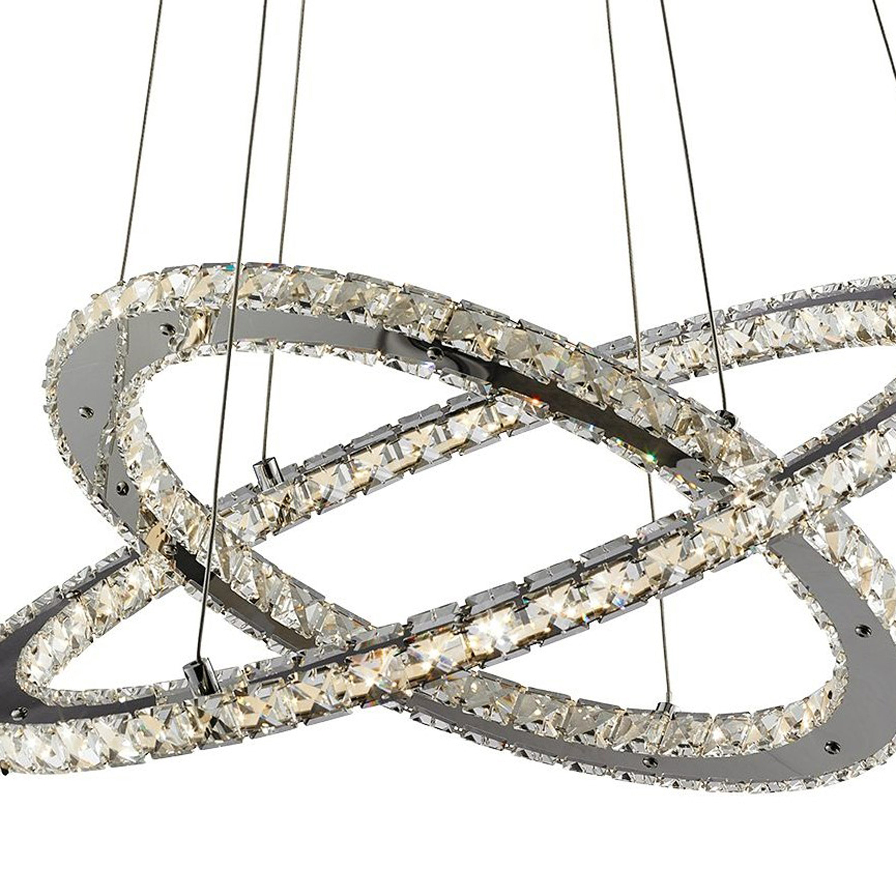 Close-up of a modern crystal LED pendant light, showing two intertwined, crystal-studded rings.
