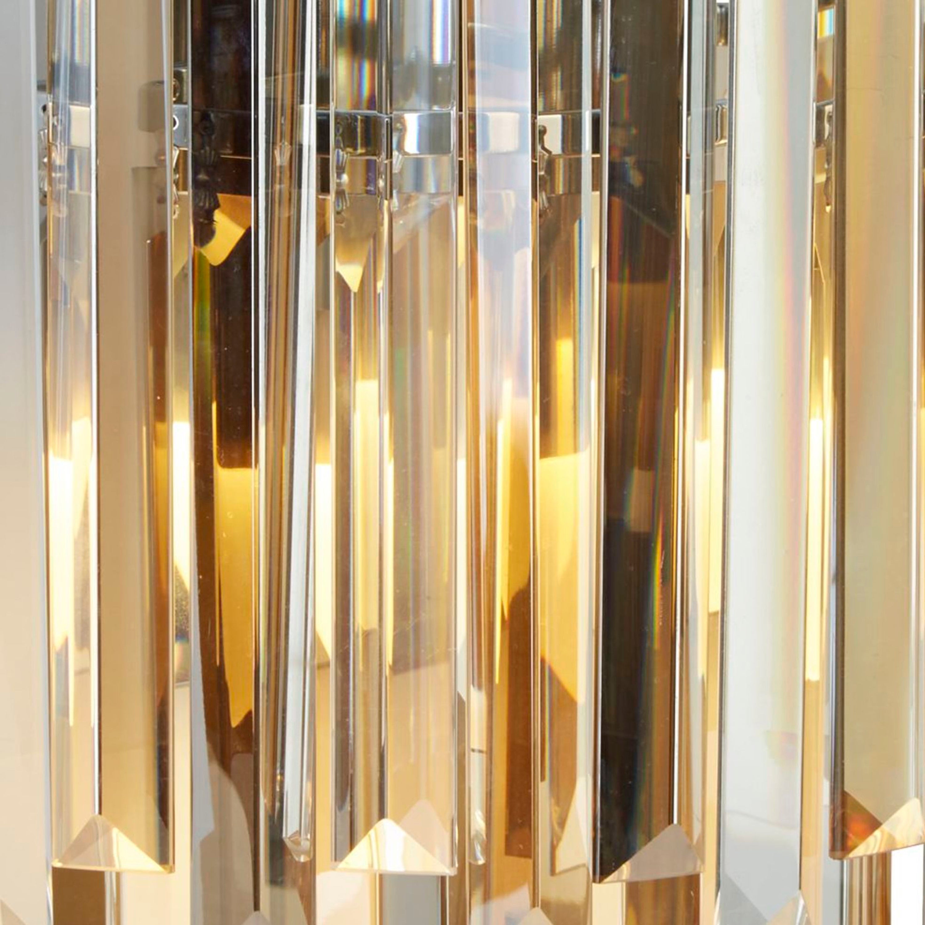 Close-up of the crystal wall light showcasing the light's intricate design.