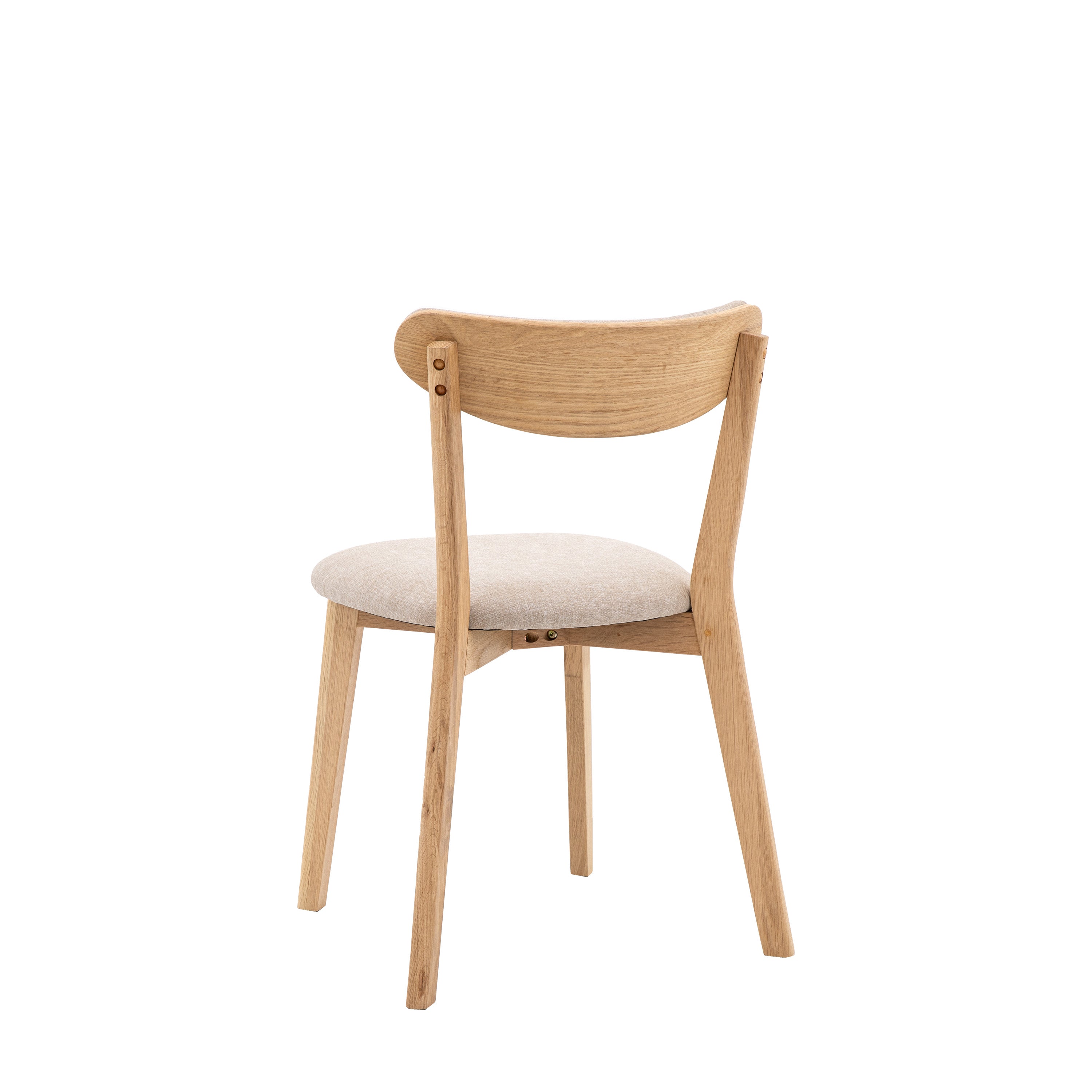 A back view of a light wood dining chair with a cream upholstered seat and back.