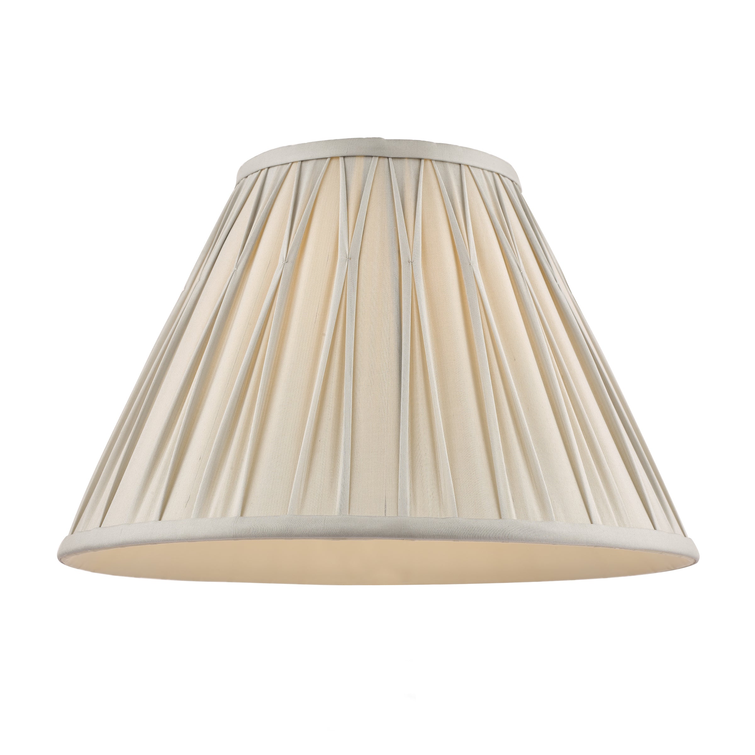 A cream pleated lamp shade.