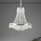 A 3-tier crystal chandelier hangs from the ceiling in a large room.