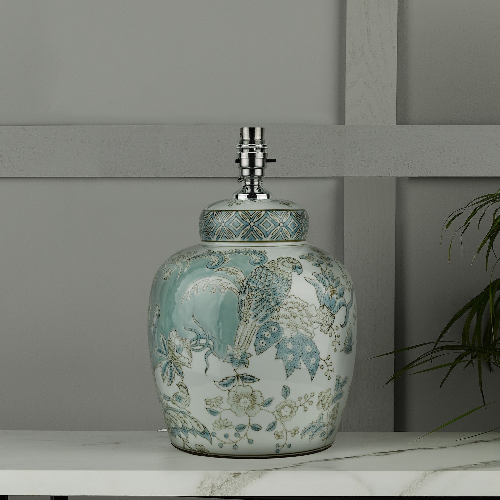 A decorative ginger jar lamp base with blue and green patterns.