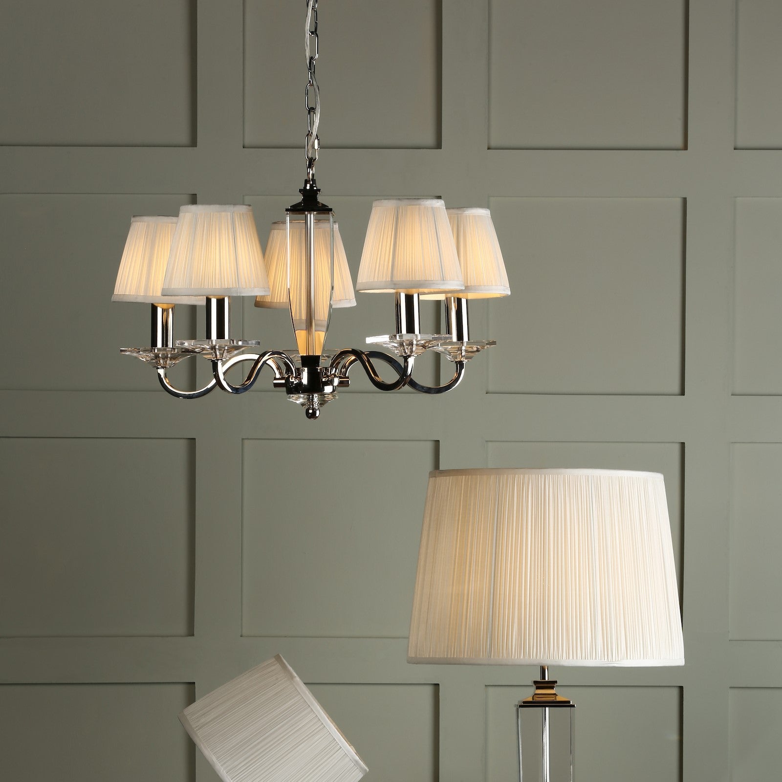 A group of light fixtures with pleated lampshades.