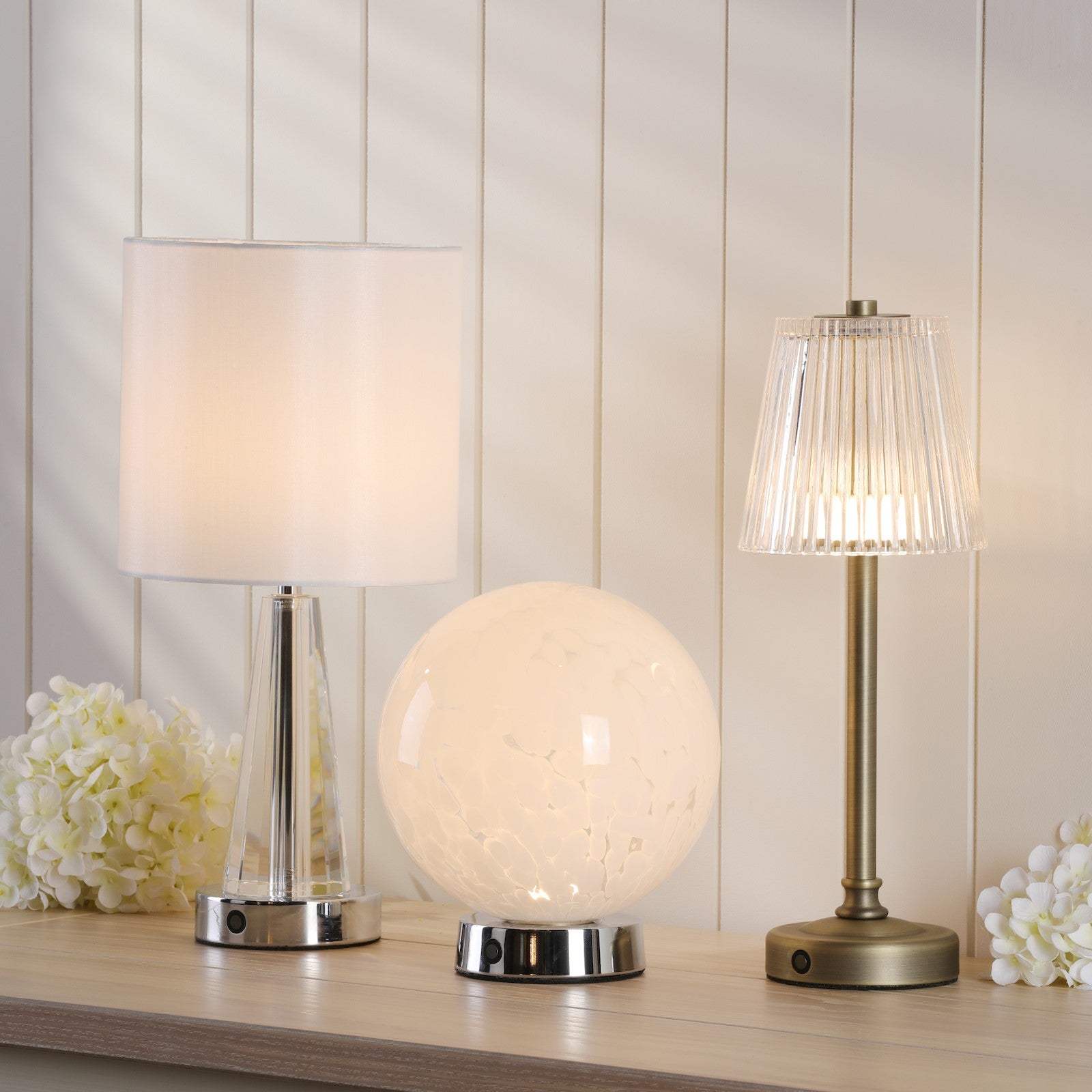 Three rechargeable table lamps.