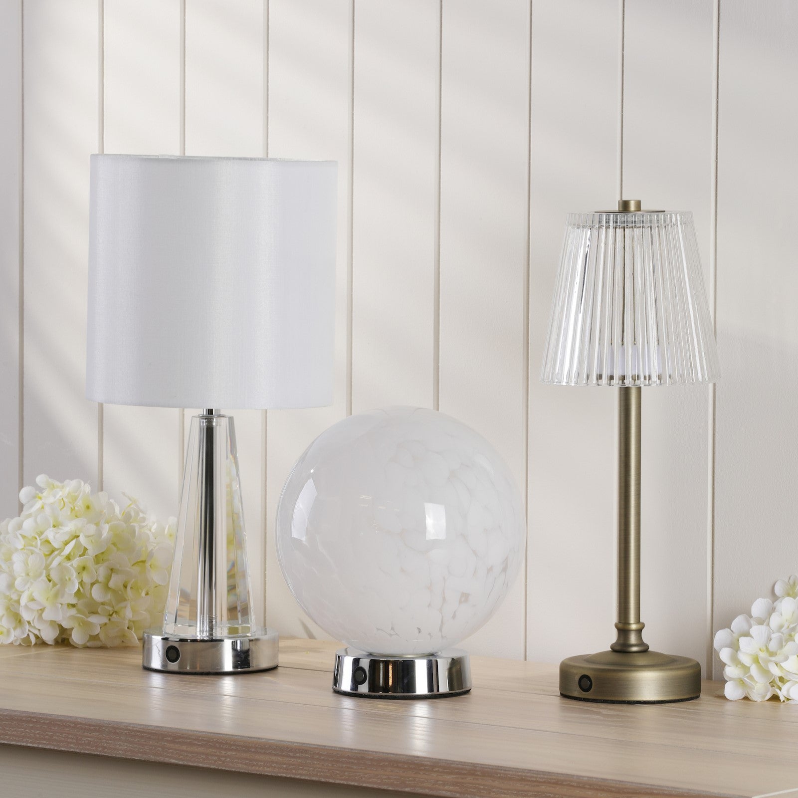 Three rechargeable table lamps.