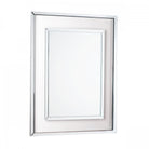 Front view of an ornate rectangular silver mirror with a smaller inner mirror.
