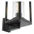Close-up of the base of a black outdoor wall light, showing the clean lines and design.