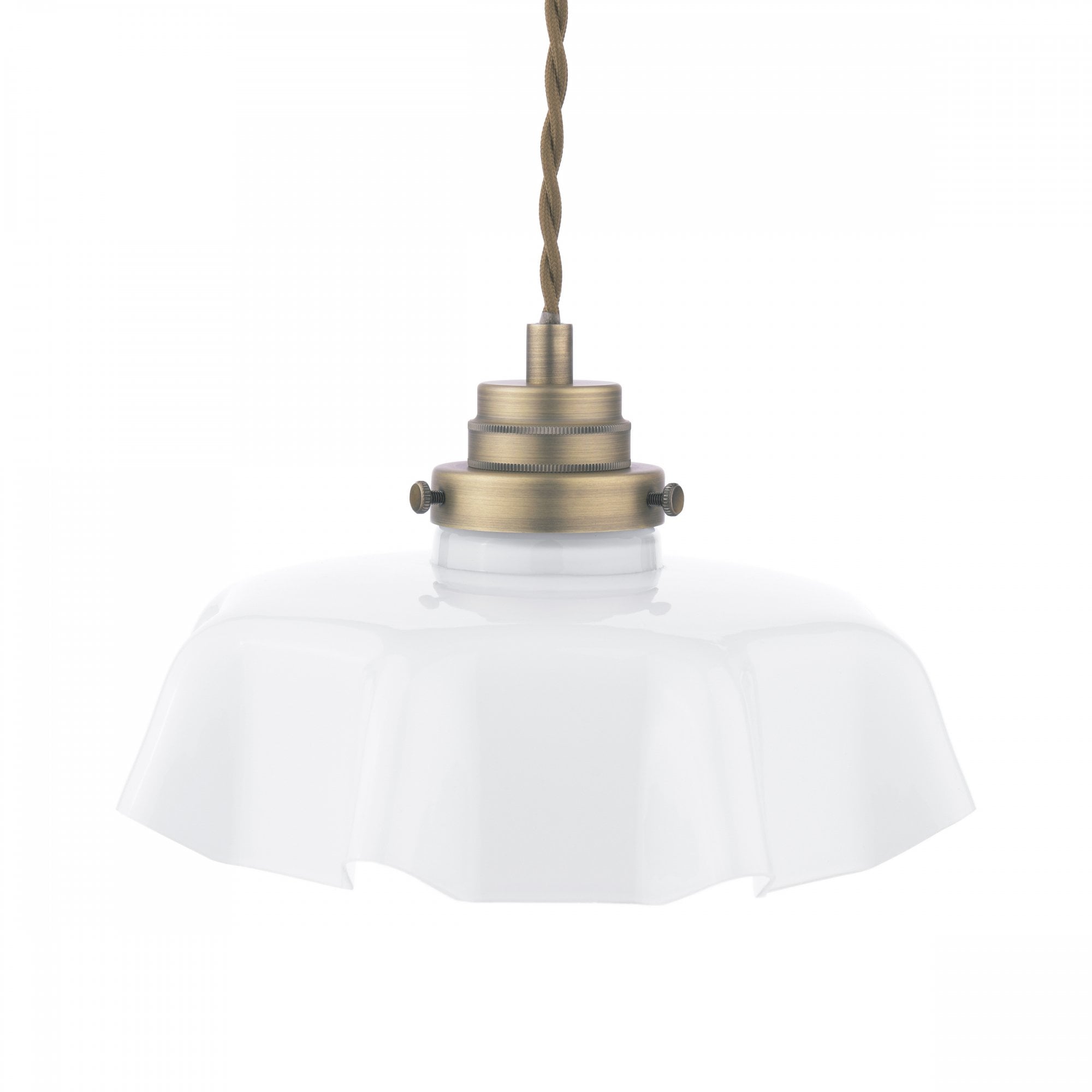 A close-up of a fluted white glass pendant light with brass accents.