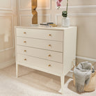 Celaine White Painted Wood Chest Of Drawers with Gold Handles by RV Astley