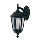 Black outdoor wall light with clear panels showcasing an energy-efficient LED bulb.